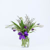 A graceful arrangement featuring elegant tulips, airy filler, and lush greenery, thoughtfully