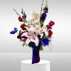 Recipe: Seasonal Anenomes, White Lisianthus, Pink Stargazers, Blue Delphinium, Red Roses, Pink
