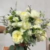 This airy hand held bouquet includes Garden Roses, Seasonal Peonies, Seasonal Ranuculus
