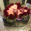 Type of Flowers: Red Roses, Purple Cymbidium Orchids, and Pink Carnations in