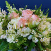 Inspired by the elegance of Chardonnay, this arrangement pairs roses, snapdragons, and
