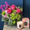 A vibrant floral arrangment in bold colors paired with the Voluspa: Kalahari