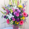 Beautiful blend of Gerberas, Lilies, Roses, Lisianthus, Delphinium, larkspur, snapdragons and chrysanthemums