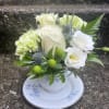 This arrangement has roses, thistle, lisianthus, carnations, Hypericum, solidago and greenery. 