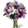 The stunning Purple Paradise Bouquet creates a bold splash of color upon