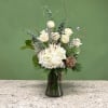 A mixed arrangement that celebrates the new year, showcasing a white and