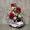 Love letters mail truck. Arrangement is approximately 12" tall and 8" wide