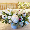 A wonderfully, white arrangement with roses, peonies, anemone, and more!