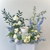 The "Clear Skies Urn Meadow" is a serene and evocative tribute, crafted