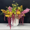 A mix of amaranthus flowers, orchids, anthurium and others