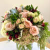 Think Classic European Elegance! A variety of seasonal flowers. Your arrangement will