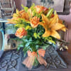 This radiant bouquet is full of flowers and fiery beauty, it makes