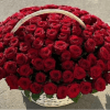 A dramatic luxury arrangement featuring an abundant display of premium red roses