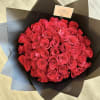 This luxurious bouquet features stunning red roses wrapped in elegant black paper