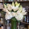 white lilies, roses, hydrangea giving it a modern style 