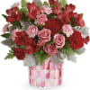 Bursting with classic red and pink blooms, this magnificent mosaic vase of