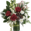 An instant Christmas party, this festive bouquet bursts with fresh blooms of