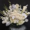 Orchid and Feather Centerpiece. This bouquet can be ordered in any color.