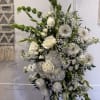 A custom white funeral stand designed with attention to detail and thoughtful