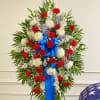 This Sympathy Standing Spray, in red, white and blue, is a beautiful