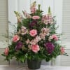 This Funeral Spray consists of Pink Snapdragons, Carnations and Wax Flower with