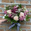Specialty Pink Roses, Mauve stock, purple alstromeria, accent florals and greens in