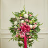 This Sympathy Standing Spray, crafted using elegant pastel blooms, is a beautiful