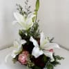 A modern, contemporary arrangement using fresh, in season blooms to accommodate a