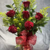 A charming mixed-rose arrangement featuring red roses accented with fresh greenery and