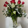Classy long stemmed, dozen rose arrangement is the perfect way to say