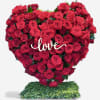 This heart-shaped standing arrangement is filled with gorgeous red Roses for an