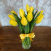 Yellow Tulips arranged in a glass vase