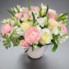 Lovely, soft blooms with blush roses, stock, freesia and hydrangeas accented with