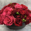 Just in time for Valentine's Day, roses overwhelm this stone vessel.