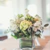green hydrangea, white stock , green hypericum, pink wax flower, eucalyptus, greens
centerpiece