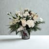 Cardinal Serenity is a peaceful winter arrangement designed in soft shades of