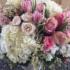 Beautiful combination of Hydrangeas, Roses, Tulips, Hyacinth, Spray Roses and elegant greens