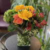 This marvelous arrangement of pinks, yellows, oranges and greens is sure to