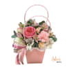 Beautiful floral arrangement in a basket, crafted with a variety of fresh