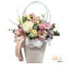 Beautiful floral arrangement in a basket, crafted with a variety of fresh