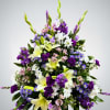 This purple, white and pink arrangement is a lovely sendoff and tribute.