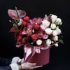 Elegant mixed floral arrangement featuring premium roses, orchids, and seasonal blooms in