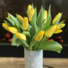 A collection of tulips in ceramic vase. Several colors available, note your