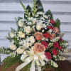 36 INCHES ONESIDED SYMPATHY ARRANGEMENT CONSISTING OF WHITE AND CORAL COLOR ROSES
