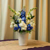 Blue and white arrangement  featuring fragrant Stock and blue delphinium. Perfect