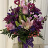 Beautiful assortment of fresh blooms beautifully designed with a valentines flair.