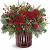 Illuminate the holiday festivities with this enchanting winter bouquet, elegantly arranged in