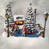 Skate into the holidays with this Thomas Kinkade's ice rink light-up collectible
