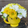 The smiling mug is filled to the brim with 3 yellow roses