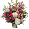 A lush, garden-style statement arrangement bursting with hot pink roses, white hydrangeas